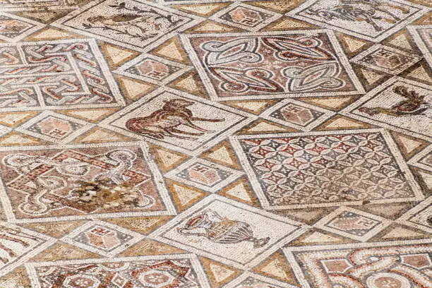 JERASH, JORDAN - APRIL 1, 2017: Mosaics at the church of Saints Cosmas and Damianus ruins at the ancient city Jerash, Jordan