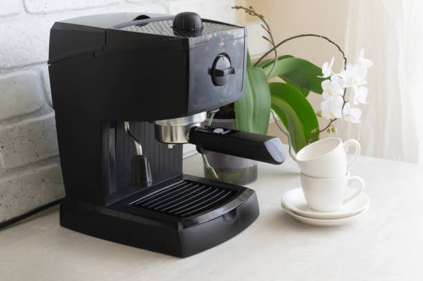 istock A black coffee machine stands on the kitchen table. Morning traditions. 1311352179