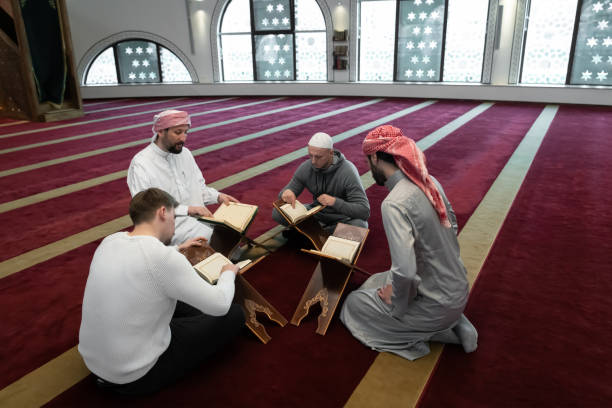 istock muslim people in mosque reading quran together 1311352534