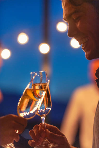 istock Couple toasting with champagne at night. 1311352631