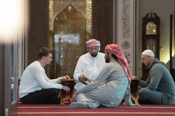istock muslim people in mosque reading quran together 1311352739
