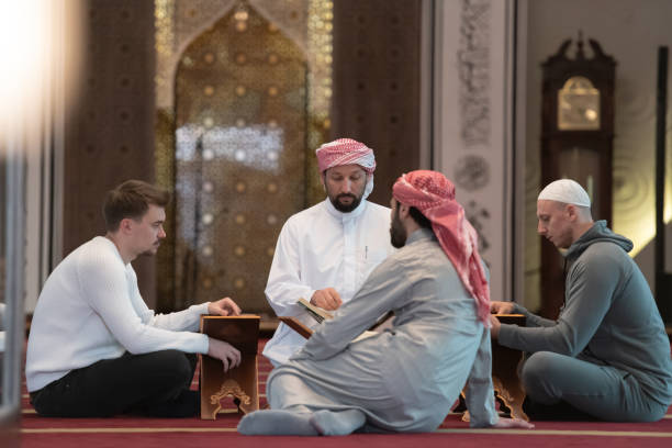 istock muslim people in mosque reading quran together 1311353301