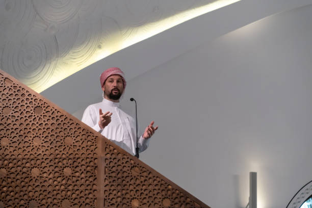 istock Muslims young arabic Imam has a speech on friday afternoon prayer in mosque. 1311354211
