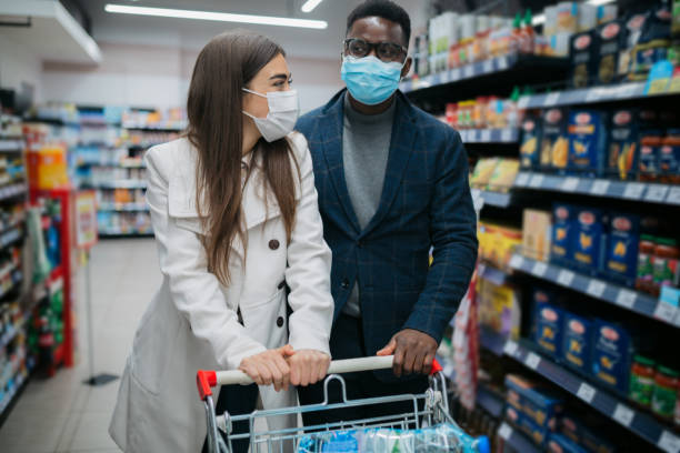 istock Young diverse couple shopping for groceries 1311354270