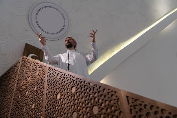 istock Muslims young arabic Imam has a speech on friday afternoon prayer in mosque. 1311354321