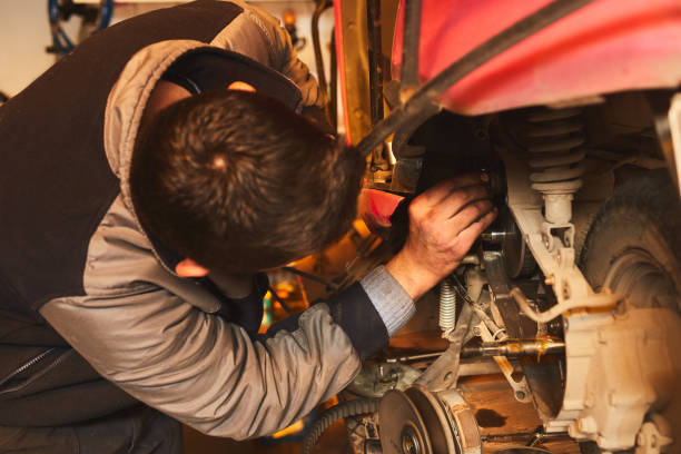 istock motorcycle mechanic doing engine repairtur 1311354468