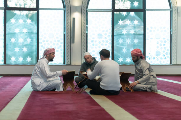 istock muslim people in mosque reading quran together 1311355033