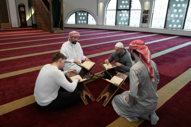 istock muslim people in mosque reading quran together 1311355056