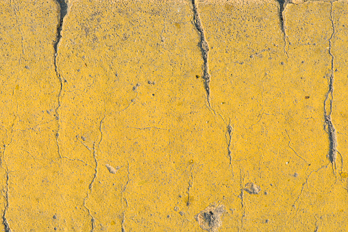 Closeup Texture abstract yellow old wall background,cement floor