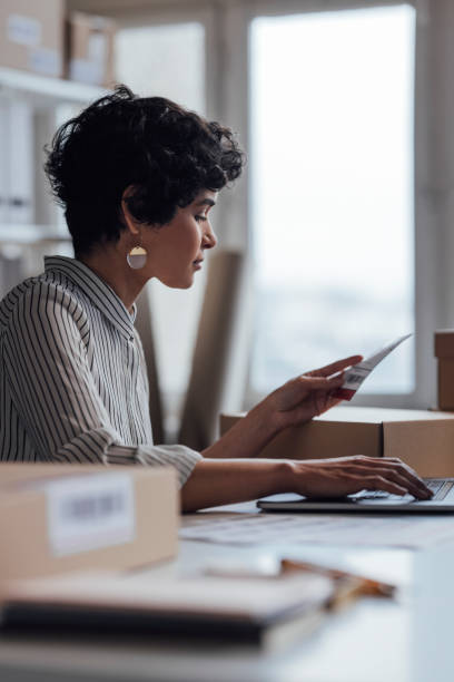 istock Beautiful Online Store Owner Working on Her Laptop 1311355233