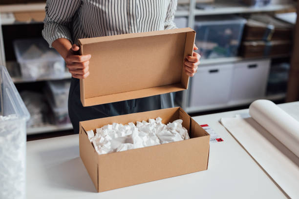 istock Anonymous Small Business Owner Packing Her Products for Delivery 1311355236