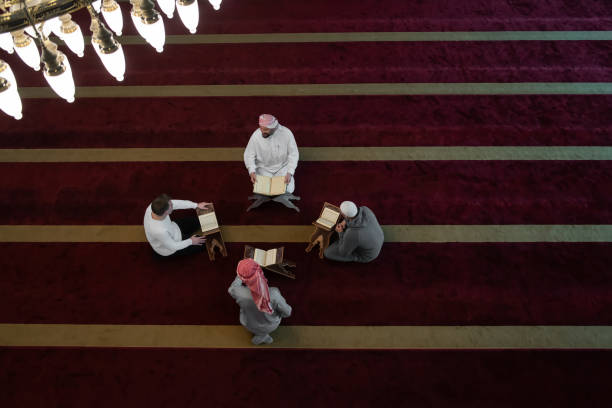 istock muslim people in mosque reading quran together 1311355856