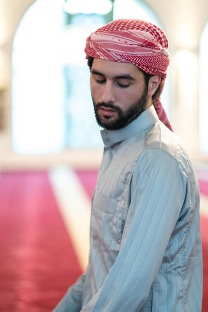 istock a Muslim ends a prayer by turning his head to the side,. 1311355887