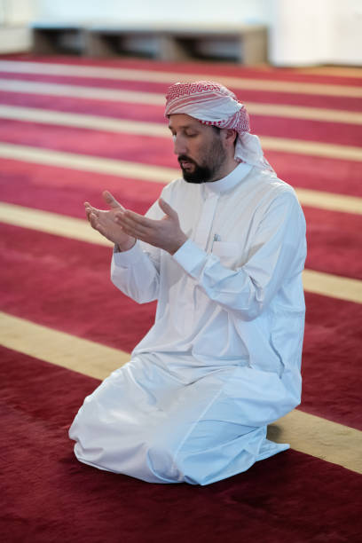 istock muslim prayer inside the mosque in namaz worship Allah 1311356039