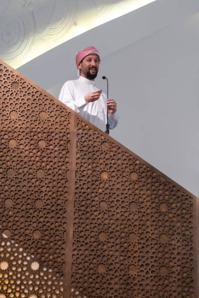 istock Muslims young arabic Imam has a speech on friday afternoon prayer in mosque. 1311356105