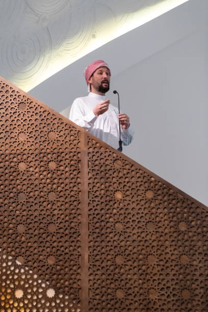 istock Muslims young arabic Imam has a speech on friday afternoon prayer in mosque. 1311356823