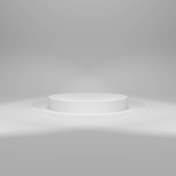 istock 3D rendering of white round pedestal on white background with two spot lights 1311356849