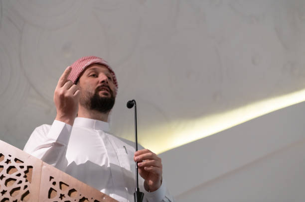 istock Muslims young arabic Imam has a speech on friday afternoon prayer in mosque. 1311357852
