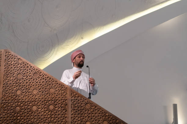 istock Muslims young arabic Imam has a speech on friday afternoon prayer in mosque. 1311358722
