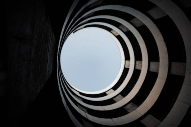 istock Modern Architecture Spiral Driveway in Parking Garage 1311358756