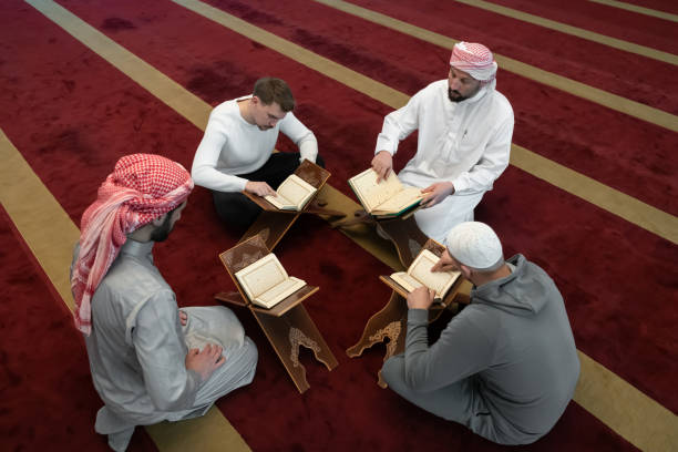 istock muslim people in mosque reading quran together 1311359406