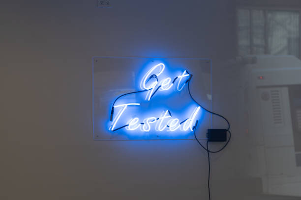 istock Get tested blue neon letters message pandemic 1311361024