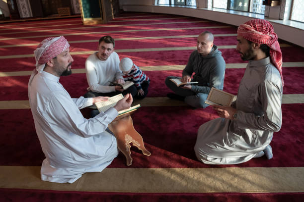 istock muslim people in mosque reading quran together 1311361036