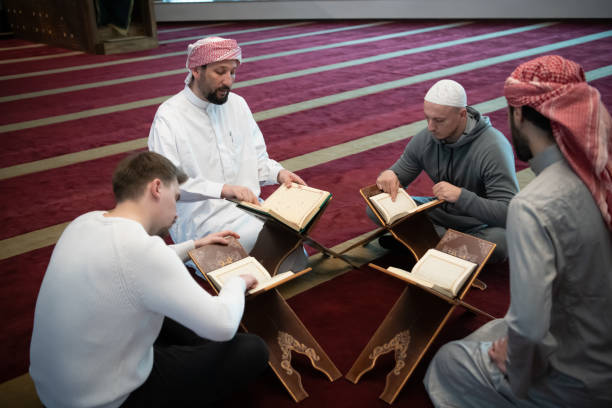 muslim people in mosque reading quran together