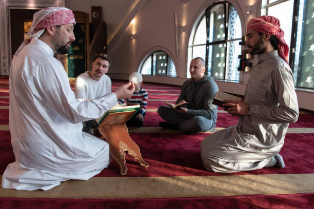 istock muslim people in mosque reading quran together 1311361913