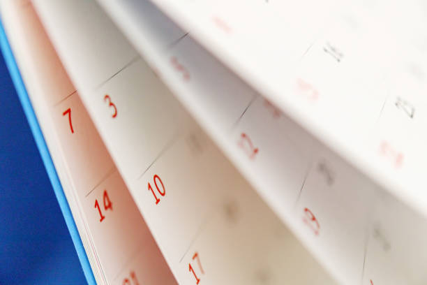 istock Calendar page flipping sheet close up on office table background business schedule planning appointment meeting concept 1311366995