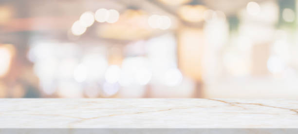 istock marble table top with blurred abstract cafe restaurant interior background 1311367022