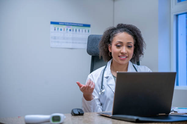 istock Female doctor on a video conference call with a patient 1311367156