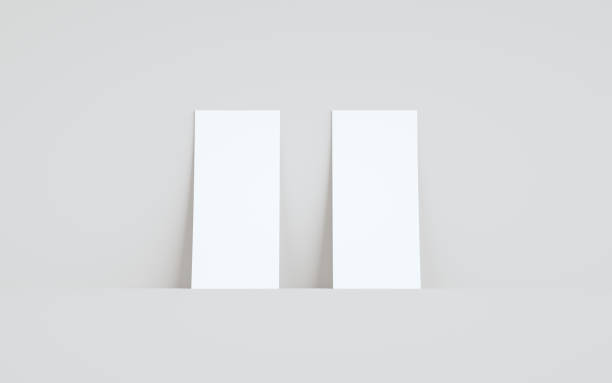 istock DL Flyer / Invitation Mock-Up - Two Flyers Against Wall Background 1311367381