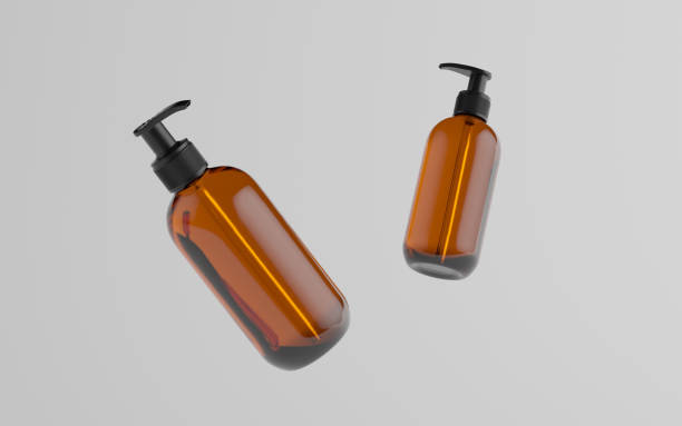 istock Amber Glass Pump Bottle Mock-Up - Liquid Soap, Shampoo Dispenser - Two Floating Bottles 1311367433