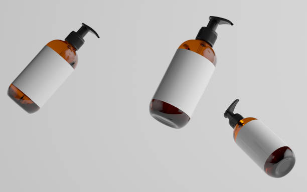 istock Amber Glass Pump Bottle Mock-Up - Liquid Soap, Shampoo Dispenser - Three Floating Bottles. Blank Label 1311367435