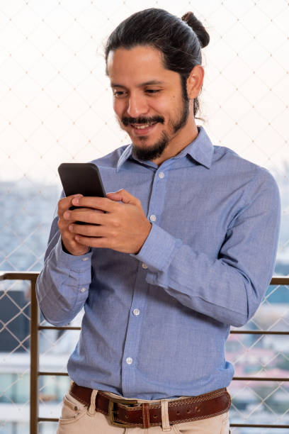 istock Young businessman using a smartphone 1311369560