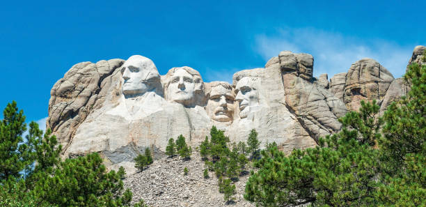 Mount Rushmore, South Dakota, USA Panorama of the carved presidents faces of Mount Rushmore national monument, South Dakota, United States of America (USA). theodore roosevelt us president stock pictures, royalty-free photos & images