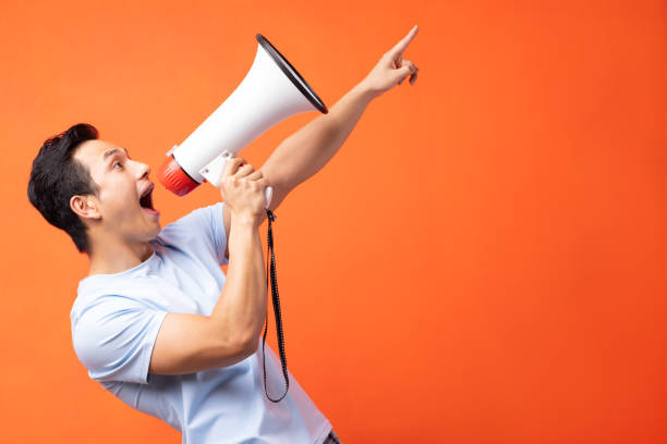 istock The man is holding a speaker 1311377091