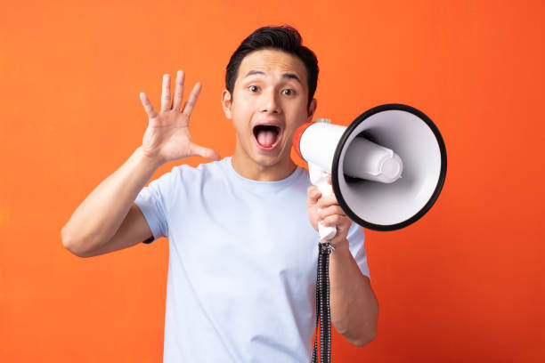 istock The man is holding a speaker 1311377092