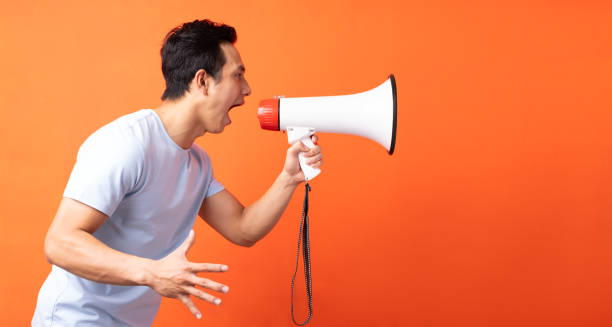 istock The man is holding a speaker 1311377118