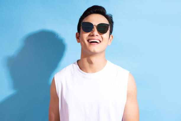 Man on background Portrait of handsome asian man wearing sunglasses, Summer vacation concept hot handsome man stock pictures, royalty-free photos & images