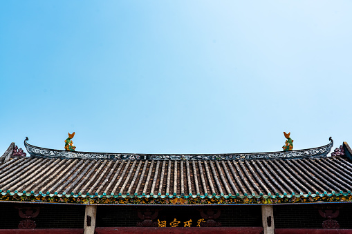 One of the roofs of Lian Shan Shuang Lin Monastery in Singapore.  It has intricate dragon carvings with the finest details.  It is the oldest Buddhist Monastery in Singapore and is gazetted as a National Monument