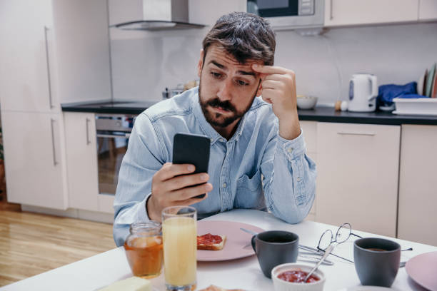 istock Man checking a phone in the morning 1311384364