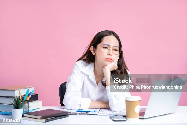 Young Asian Women Are Tired From Office Work Isolated Pastel Pink Background Stock Photo - Download Image Now