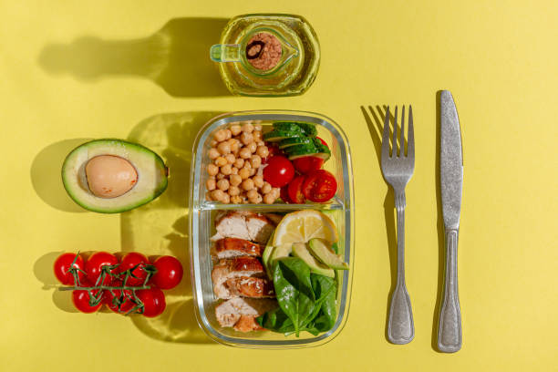istock Lunch box with chicken, avocado, cucumber, tomato and spinach 1311388175