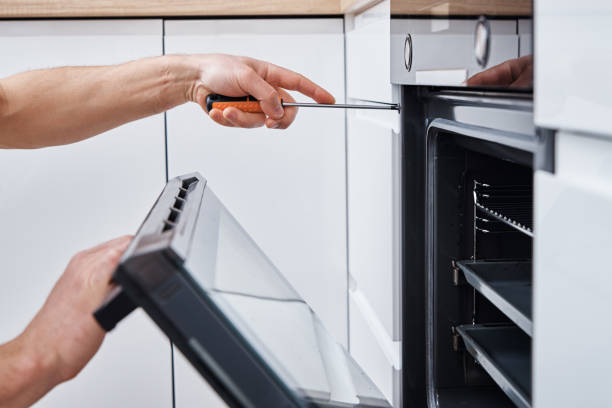 istock Handyman install oven in the kitchen 1311389244