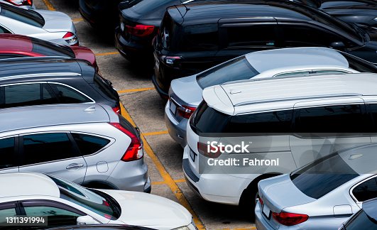 istock Car parked at the parking lot of the airport for rental. Aerial view of car parking lot of the airport. Used luxury car for sale and rental service. Automobile parking space. Car dealership concept. 1311391994