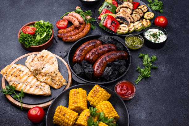istock Grilled sausages, meat, and vegetables. 1311392287