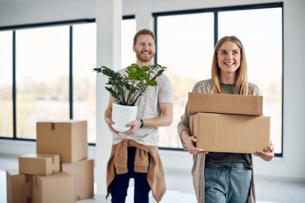 istock Young happy couple moving into their new home. 1311392871