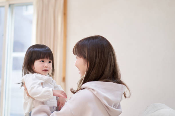 istock Asian mom hugging her daughter 1311393127